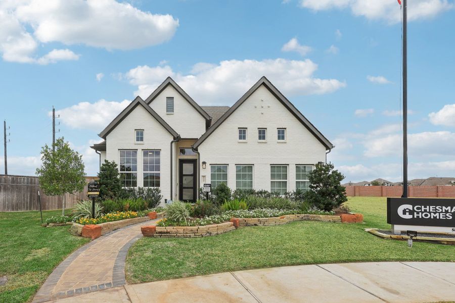 Front exterior of a new home in Wood Leaf Reserve, Tomball, TX, highlighting curb appeal (Image 22).