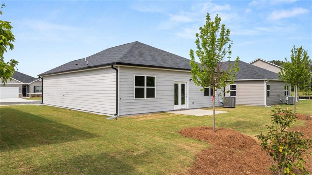 Exterior details and patio area of a home in Champion's Run, Lithonia (Image 23).