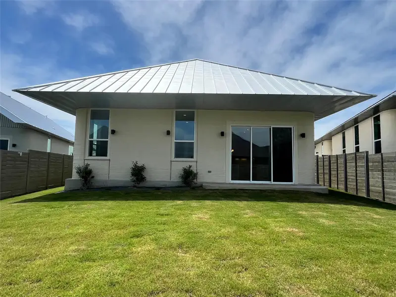Exterior details and patio area of a home in Wolf Ranch: Genesis Collection, Georgetown (Image 3).