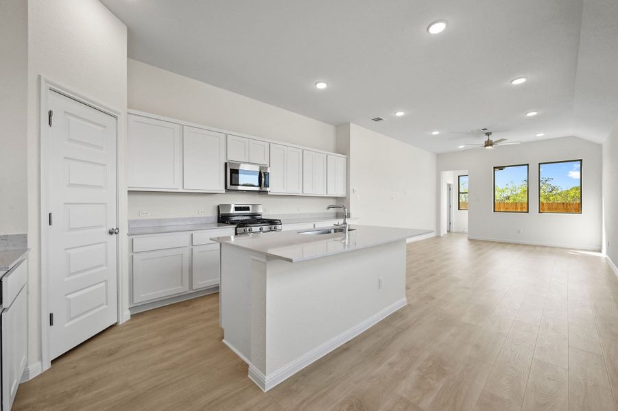 Kitchen in the Cedar home plan by Trophy Signature Homes – REPRESENTATIVE PHOTO