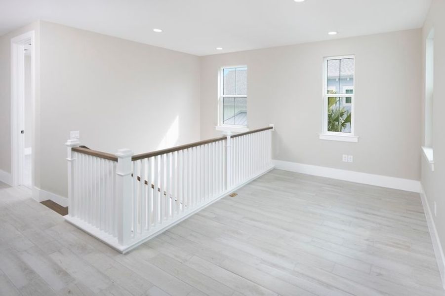 Representative unfurnished interior of a home built from the Grand Mainsail by Minto Communities in Latitude Margaritaville Watersound, Panama City Beach (Image 13).