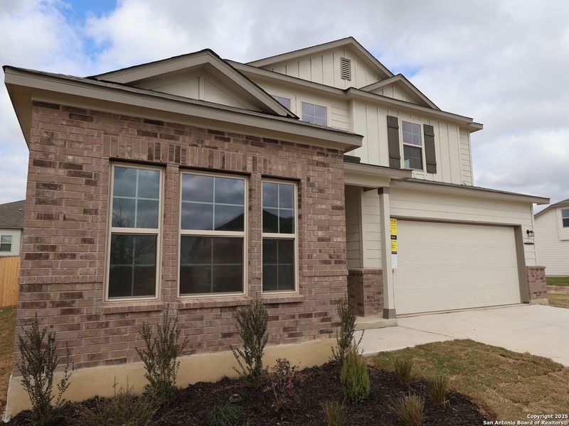 Front exterior of a new home in Greenspoint Heights, Seguin, TX, highlighting curb appeal (Image 21).