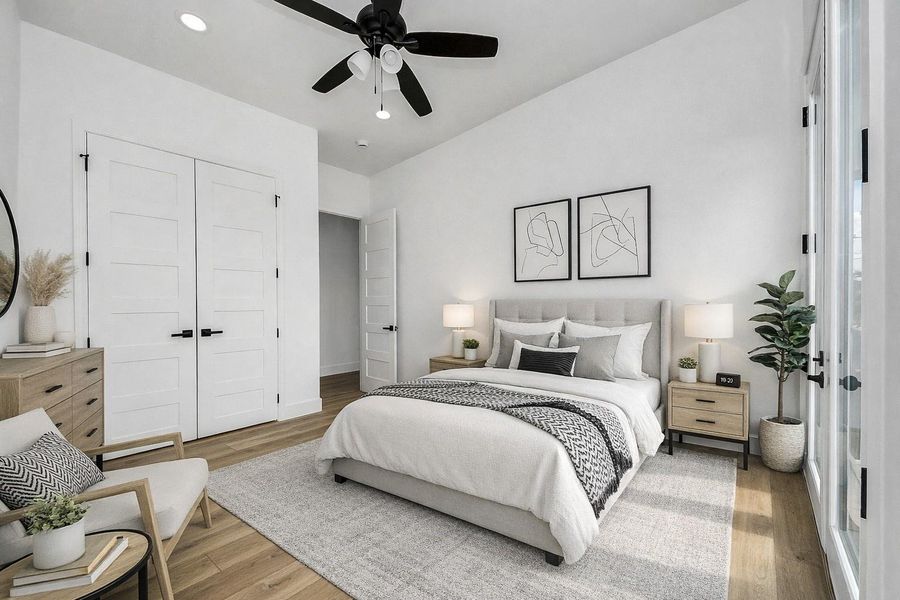 Bright and inviting guest bedroom featuring modern finishes, abundant natural light, and a clean, neutral design. A comfortable and versatile space perfect for hosting guests or creating a cozy retreat.