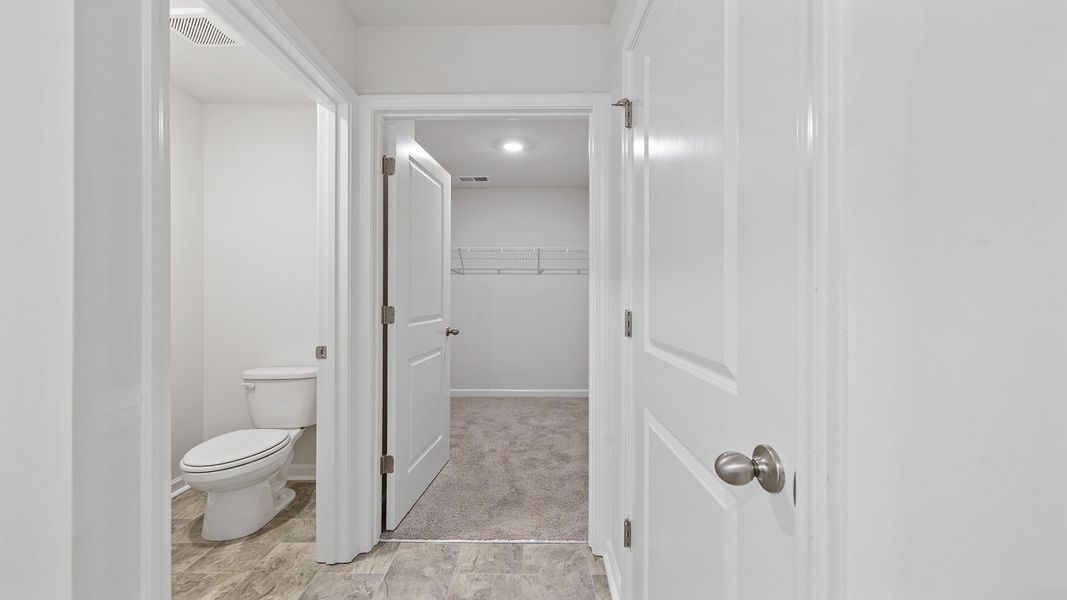 Furnished interior view inside a new home in Bentley Park, Greenwood (Image 12).