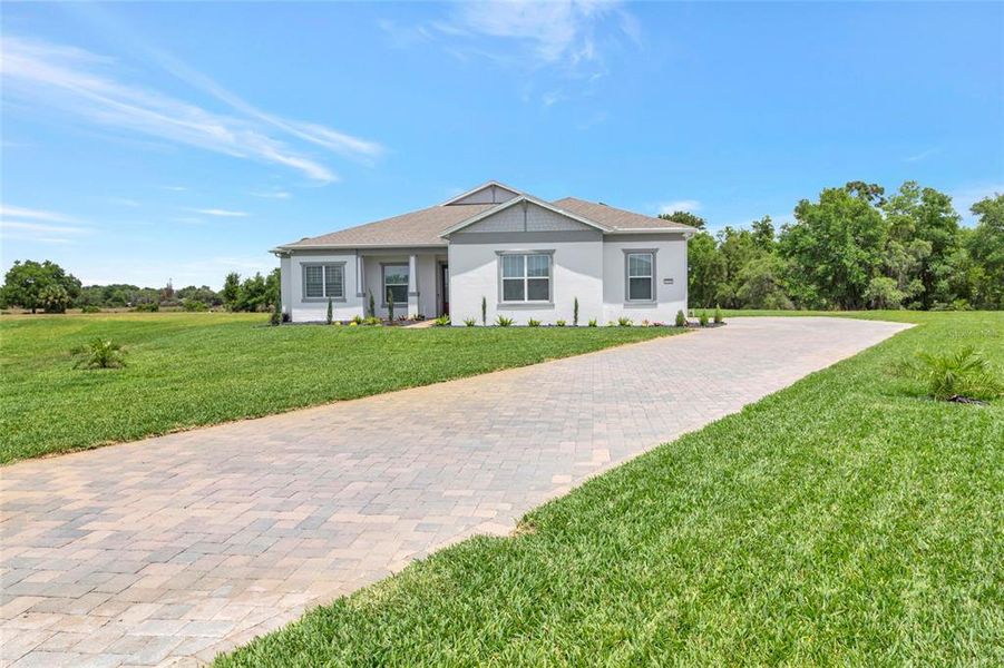 Front exterior of a new home in , Orlando, FL, highlighting curb appeal (Image 2).