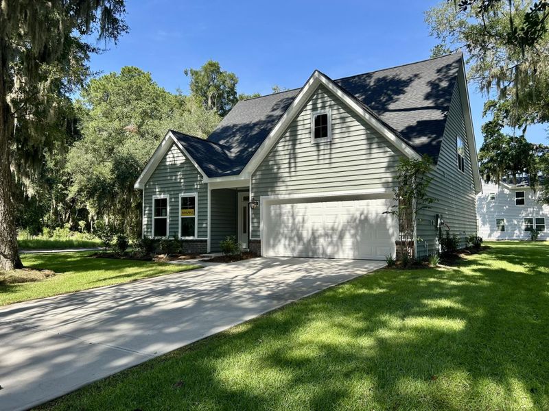 Front exterior of a new home in Academy Park, Beaufort, SC, highlighting curb appeal (Image 13). Front exterior of a new home in Academy Park, Beaufort, SC, highlighting curb appeal (Image 13).
