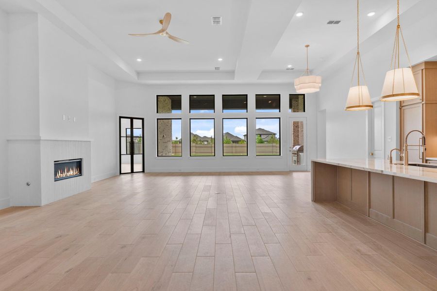The open floor plan includes space for a breakfast area. Representative image.