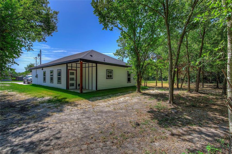 Front exterior of a new home in , Greenville, TX, highlighting curb appeal (Image 19). Front exterior of a new home in , Greenville, TX, highlighting curb appeal (Image 19).