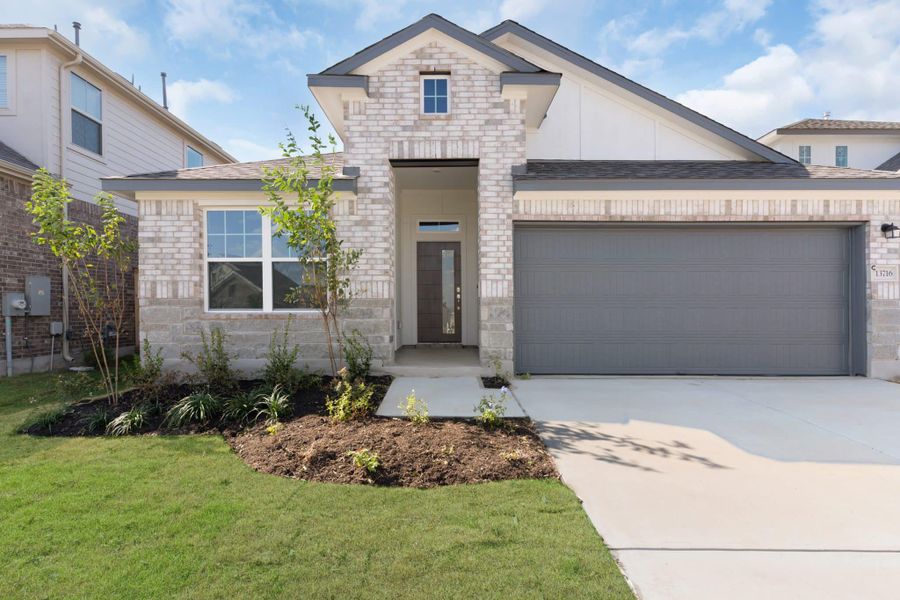 Front exterior of a new home in Briarwood, Elgin, TX, highlighting curb appeal (Image 28).