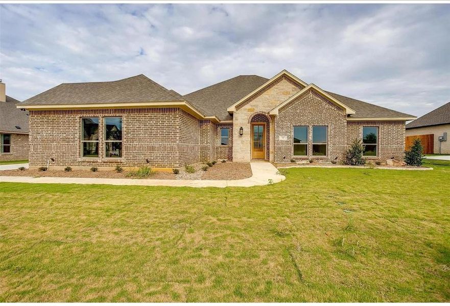 View of front of property with a front lawn