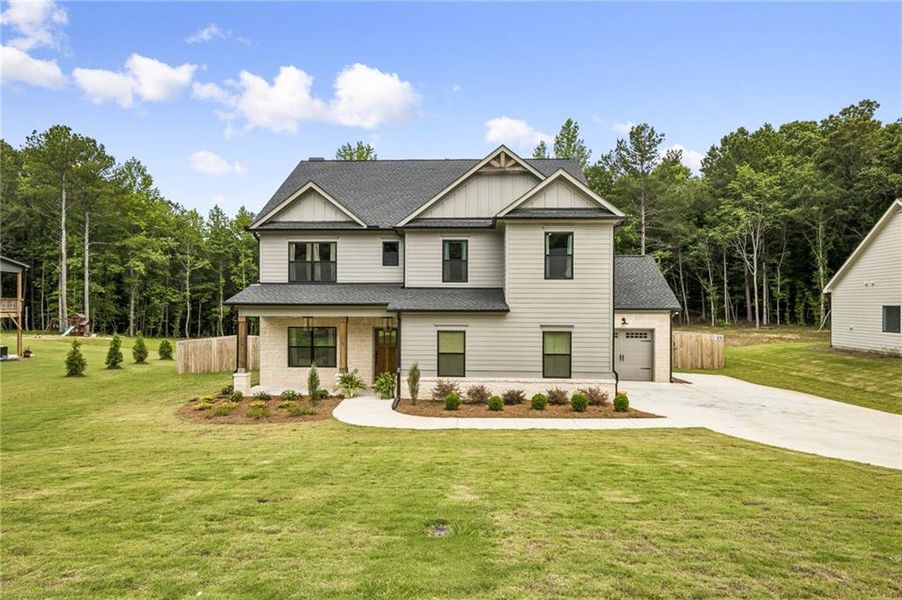 Front exterior of a new home in , Winder, GA, highlighting curb appeal (Image 2). Front exterior of a new home in , Winder, GA, highlighting curb appeal (Image 2).