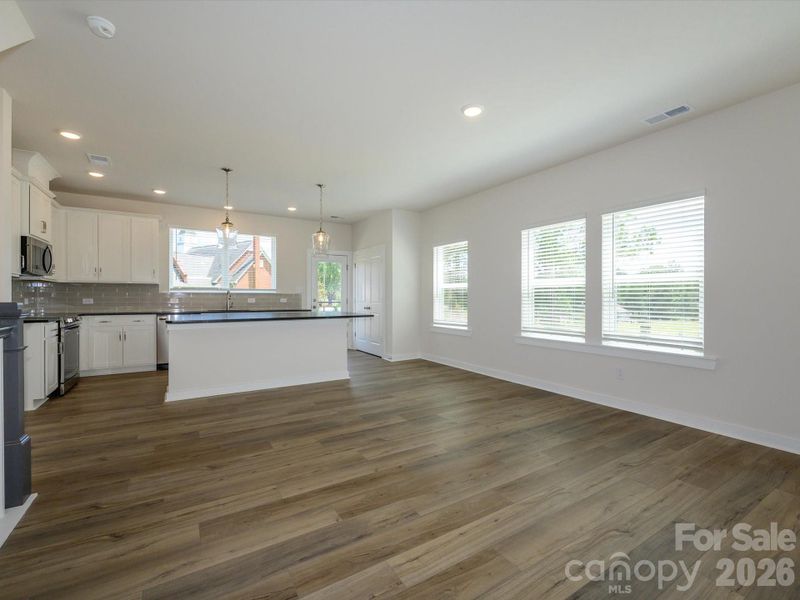 Spacious, unfurnished interior of a new home in Central Living at Craig, Charlotte (Image 17).