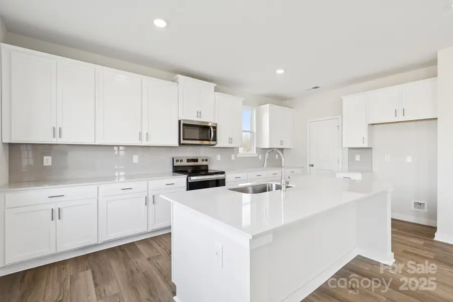 Furnished interior view inside a new home in Running Creek, Locust (Image 6).