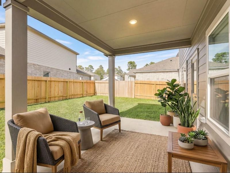 Exterior details and patio area of a home in Lakes at Black Oak, Magnolia (Image 4).
