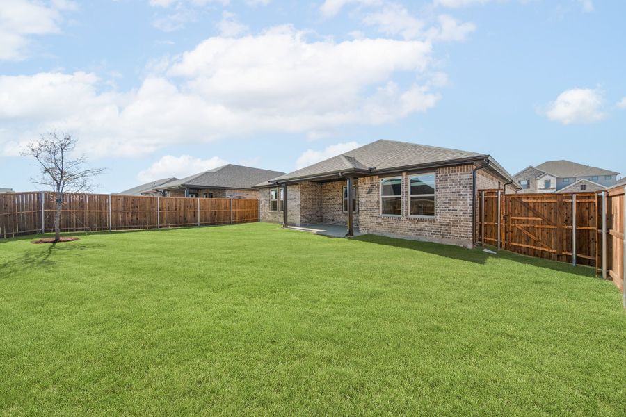 Exterior details and patio area of a home in Whitewing Trails, Princeton (Image 2).