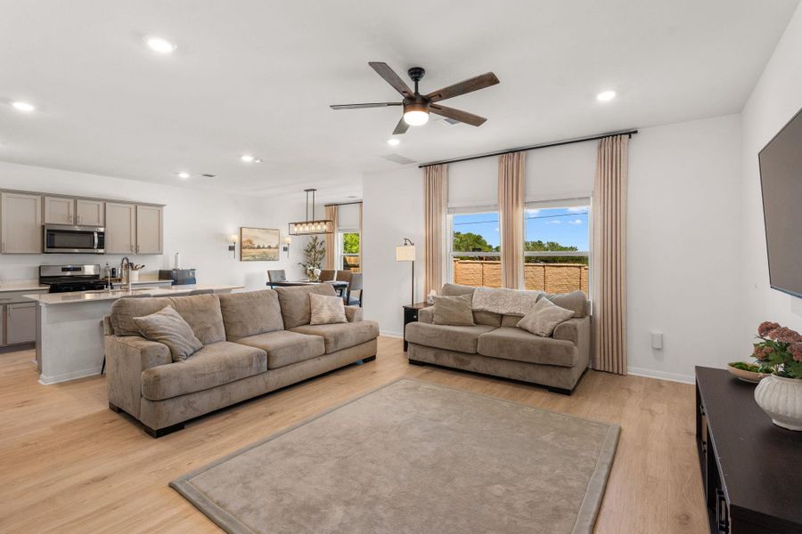 An open-concept living area flows into a well-appointed kitchen, creating an inviting space for gathering. An open-concept living area flows into a well-appointed kitchen, creating an inviting space for gathering.