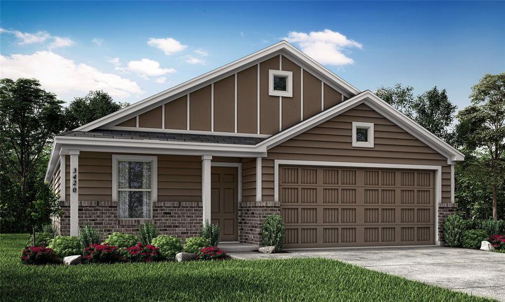 View of front of property featuring a front yard and a garage