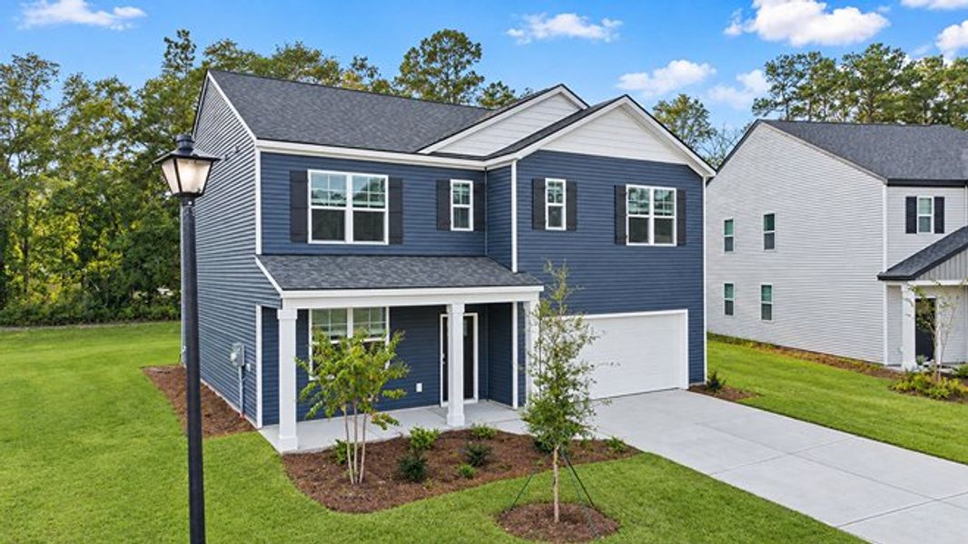 Front exterior of a new home in Pine Hills at Cane Bay, Summerville, SC, highlighting curb appeal (Image 2).