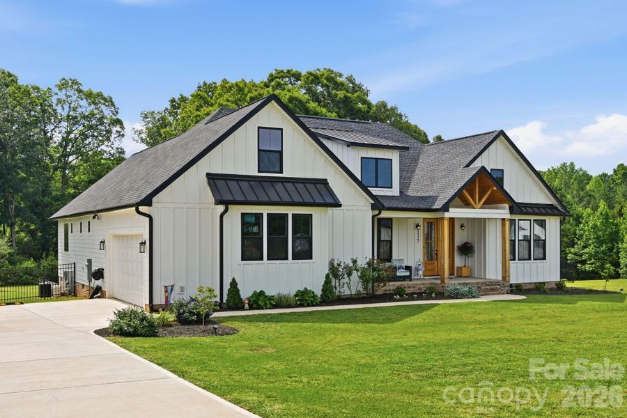 Front exterior of a new home in , Clover, SC, highlighting curb appeal (Image 1). Front exterior of a new home in , Clover, SC, highlighting curb appeal (Image 1).