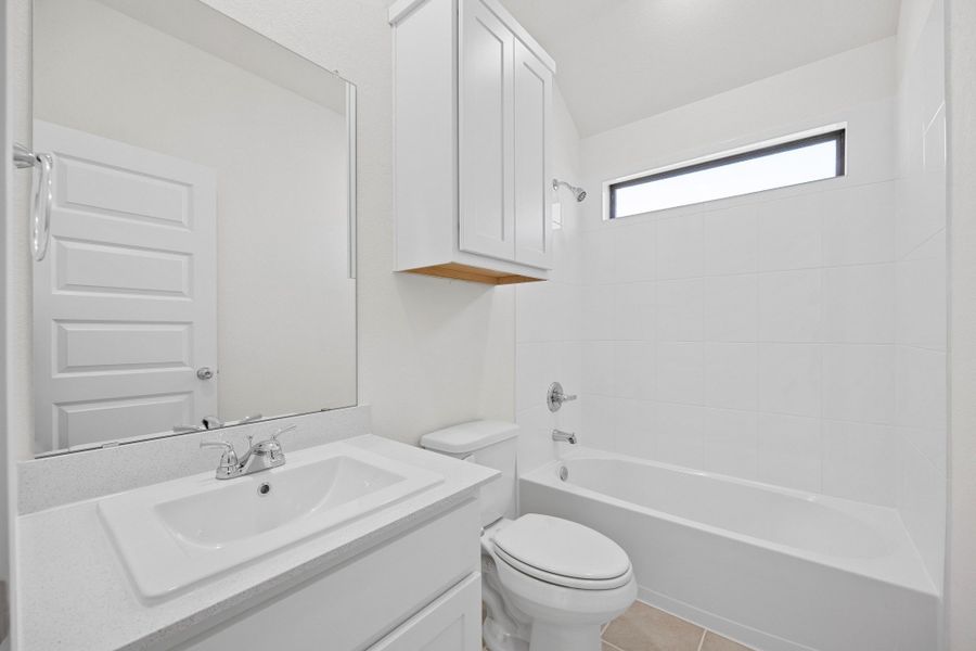 Bathroom in the Cypress home plan by Trophy Signature Homes - REPRESENTATIVE PHOTO