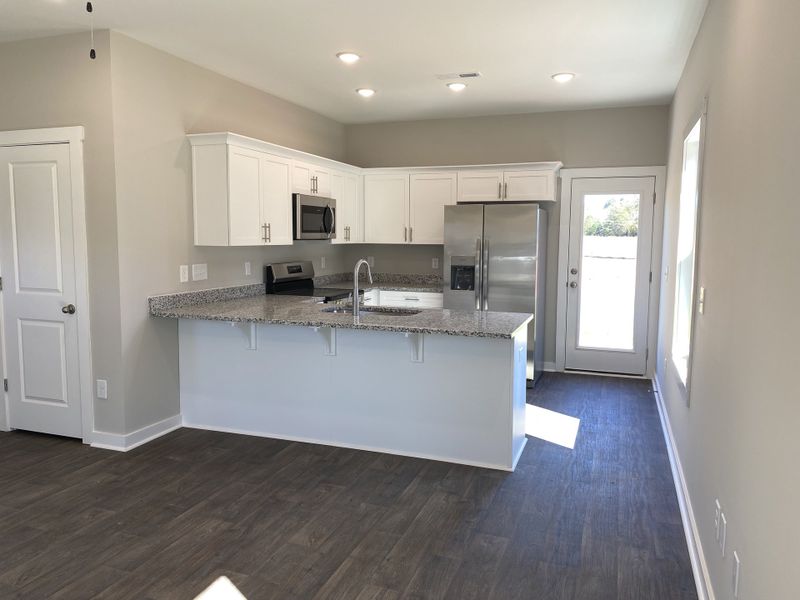 Representative furnished interior of a home built from the Tyler II by Foundation Home Builders LLC in Pinnix Loop, Burlington (Image 4).