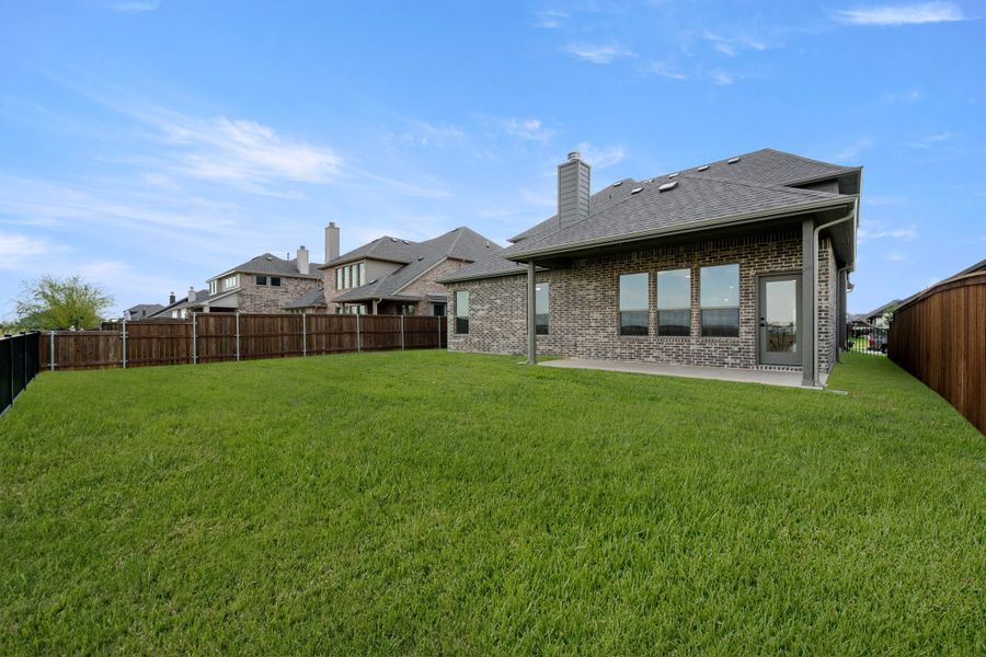 Exterior details and patio area of a home in Silo Mills, Joshua (Image 19).