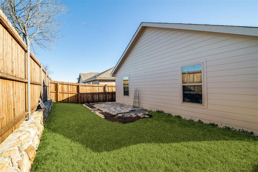 View of yard with a patio and a fenced backyard