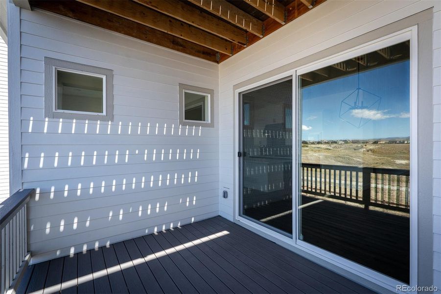 Exterior details and patio area of a home in Revel Crossing at Wolf Ranch - The Panorama Collection, Colorado Springs (Image 2).