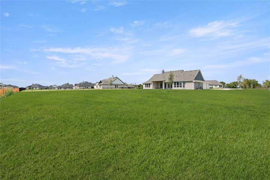Front exterior of a new home in The Meadows, Gunter, TX, highlighting curb appeal (Image 21).