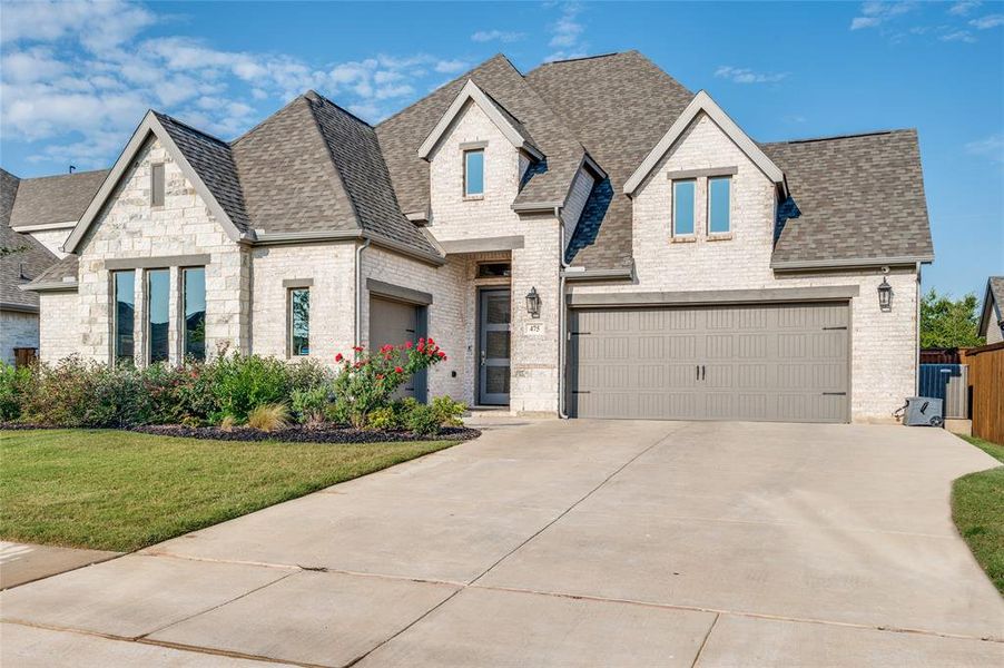 Front exterior of a new home in , Haslet, TX, highlighting curb appeal (Image 13).