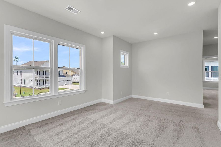 Spacious, unfurnished interior of a new home in Tidewater at Lakes of Cane Bay, Summerville (Image 25).