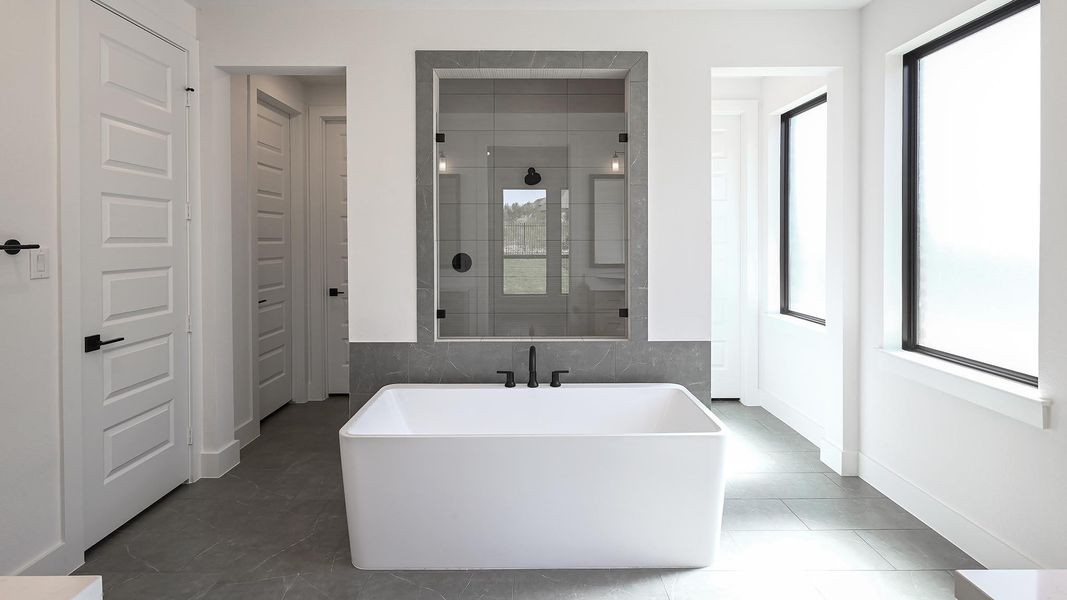 Bathroom with plenty of natural light, a walk in shower, and a soaking tub Bathroom with plenty of natural light, a walk in shower, and a soaking tub