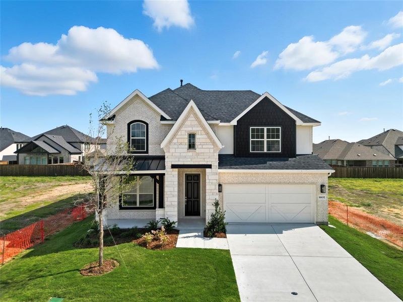 View of front of property featuring an attached garage, driveway, stone siding, brick siding, and a shingled roof View of front of property featuring an attached garage, driveway, stone siding, brick siding, and a shingled roof