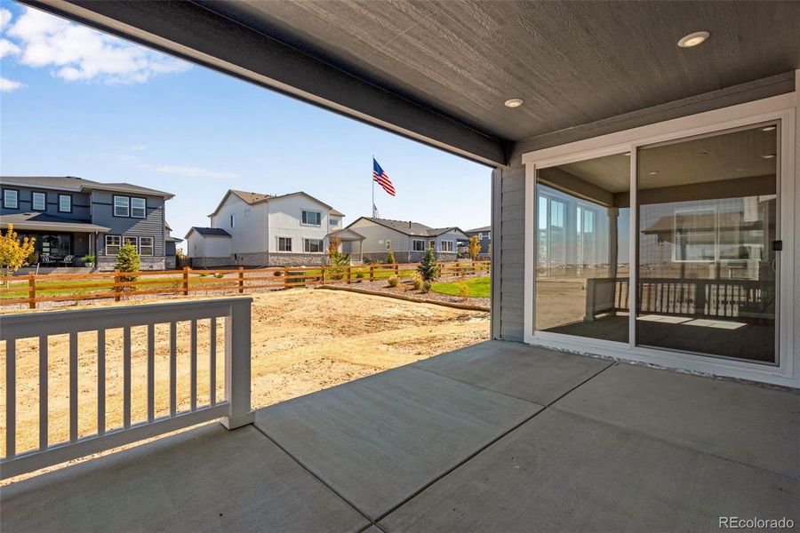 Front exterior of a new home in Ensemble at The Aurora Highlands, Aurora, CO, highlighting curb appeal (Image 27). Front exterior of a new home in Ensemble at The Aurora Highlands, Aurora, CO, highlighting curb appeal (Image 27).