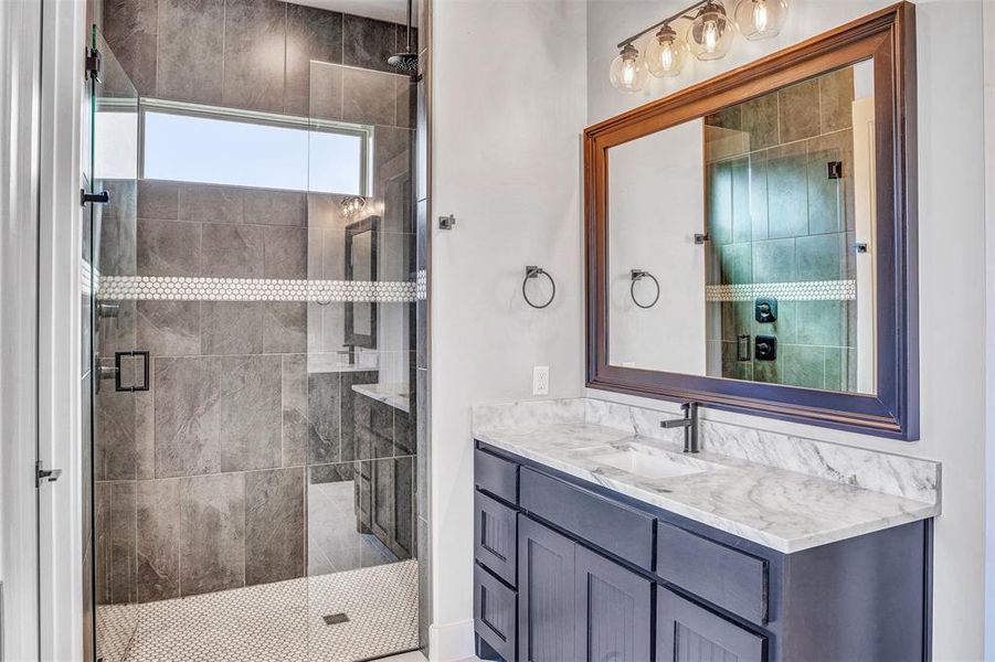 Bathroom with vanity and walk in shower