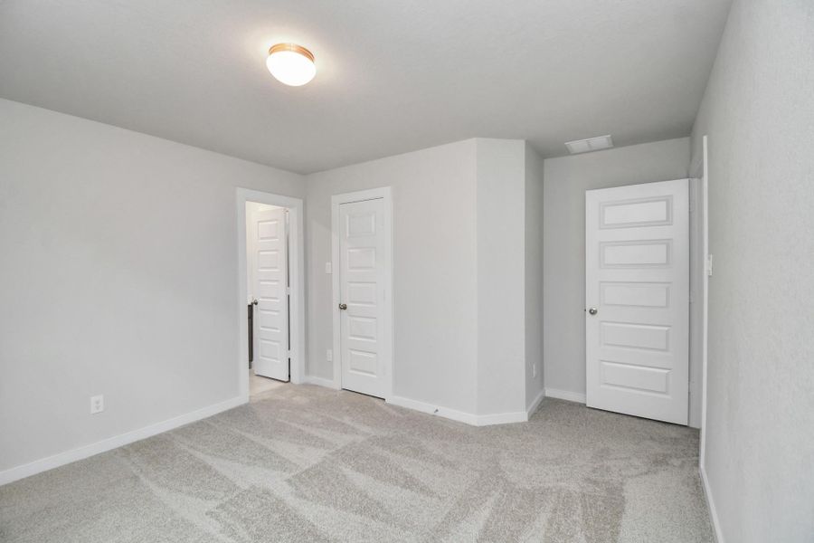 Secondary bedroom features plush carpeting, large windows that let in plenty of natural light, bright paint, and spacious closets. Secondary bedroom features plush carpeting, large windows that let in plenty of natural light, bright paint, and spacious closets.