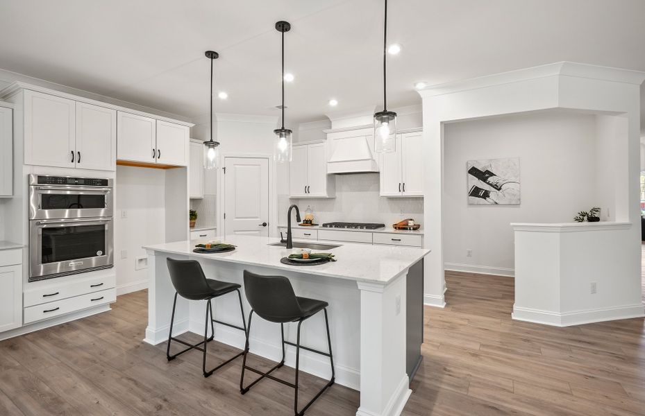 Bright Open Kitchen with Large Island and Café