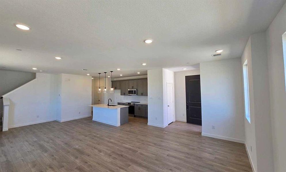 Open Kitchen-Living-Dining Room Construction Progress featuring the Minimalist Collection
