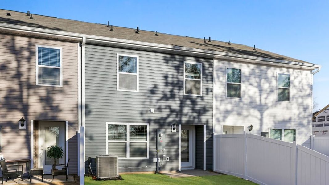 Exterior details and patio area of a home in Chestnut Ridge Townhomes, Greenville (Image 21). Exterior details and patio area of a home in Chestnut Ridge Townhomes, Greenville (Image 21).