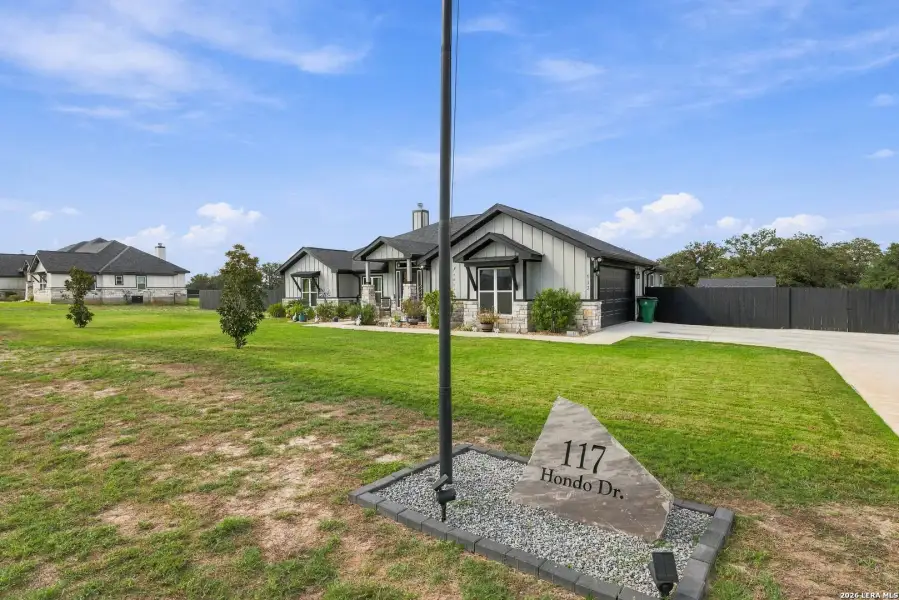 Front exterior of a new home in , La Vernia, TX, highlighting curb appeal (Image 22). Front exterior of a new home in , La Vernia, TX, highlighting curb appeal (Image 22).