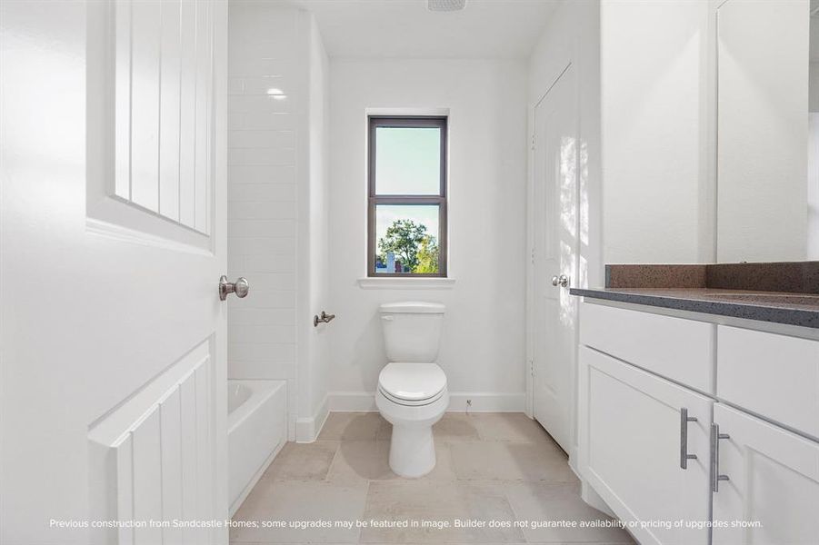 Graceful Convenience: The hall bathroom serves as an oasis of elegance and practicality, thoughtfully equipped to cater to both guests and family with stylish fixtures and serene finishes.