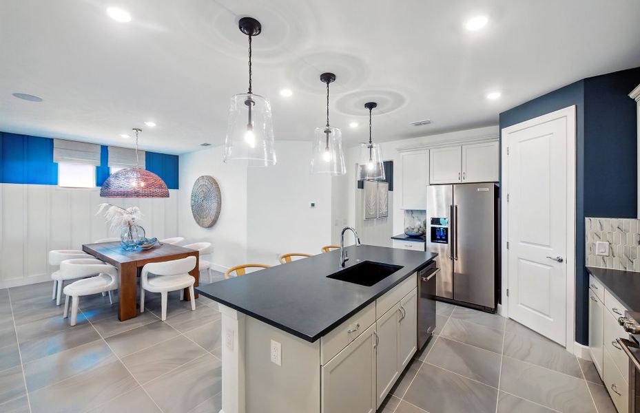 Island overlooking the gathering room of this new home Island overlooking the gathering room of this new home