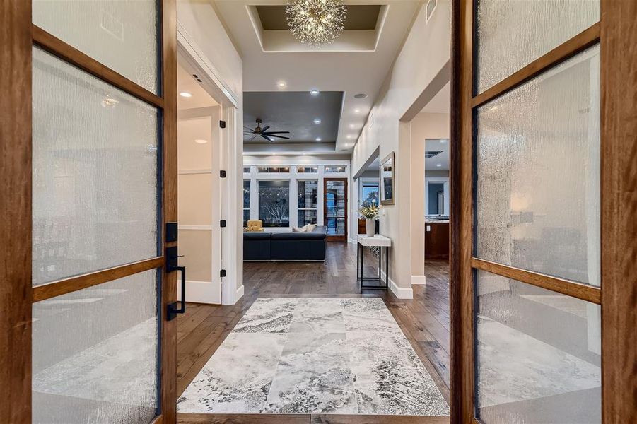 Step inside to open floor plan and the Hickory engineered hardwood floors with a porcelain inlay.