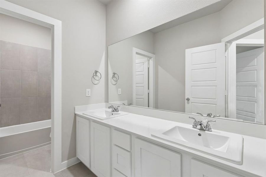 Bathroom in the Winters home plan by Trophy Signature Homes – REPRESENTATIVE PHOTO