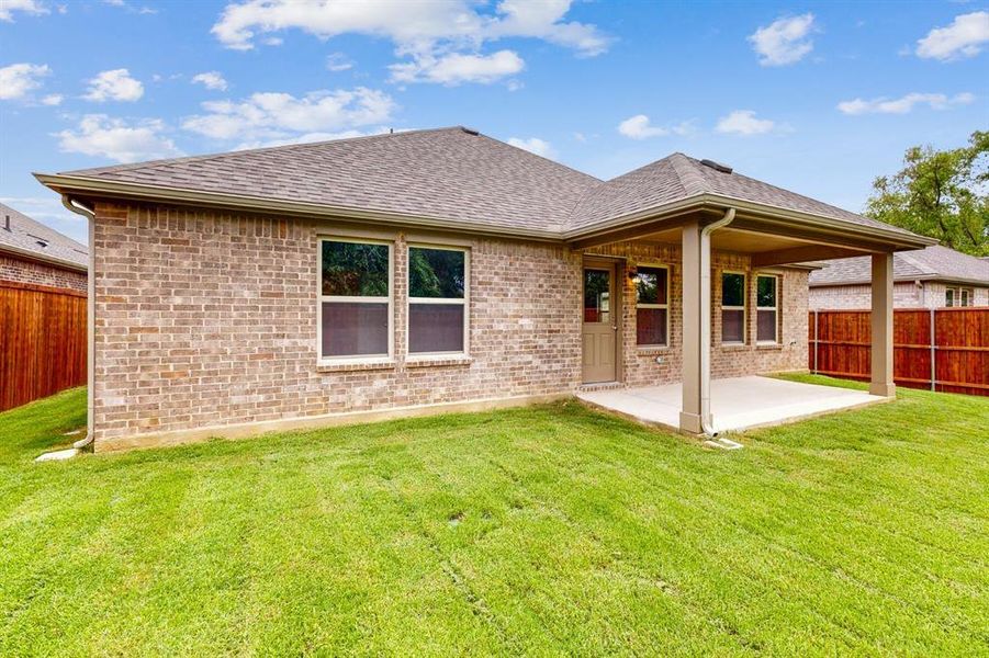 Front exterior of a new home in Kings Way, Denton, TX, highlighting curb appeal (Image 19). Front exterior of a new home in Kings Way, Denton, TX, highlighting curb appeal (Image 19).