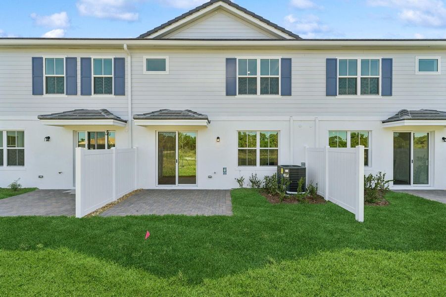Exterior details and patio area of a home in Salerno Reserve Townhomes, Stuart (Image 2). Exterior details and patio area of a home in Salerno Reserve Townhomes, Stuart (Image 2).