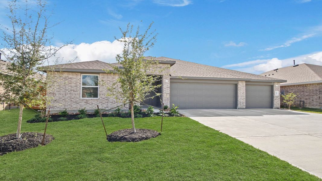 Front exterior of a new home in River Ranch Meadows, Dayton, TX, highlighting curb appeal (Image 21). Front exterior of a new home in River Ranch Meadows, Dayton, TX, highlighting curb appeal (Image 21).