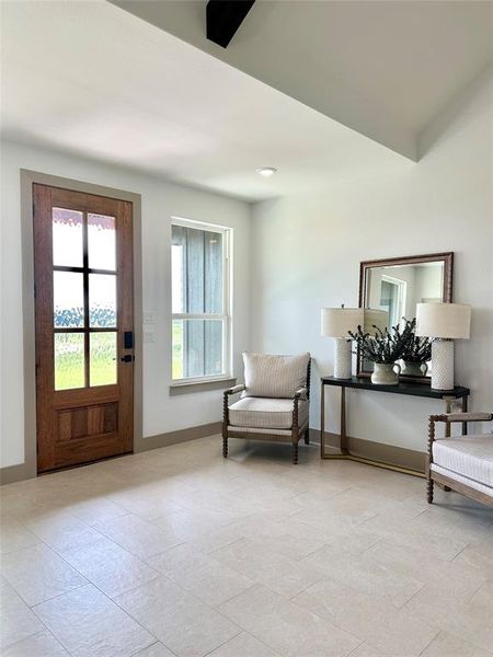 Sitting room featuring baseboards
