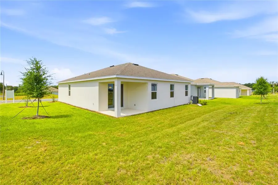 Exterior details and patio area of a home in , Okahumpka (Image 22).