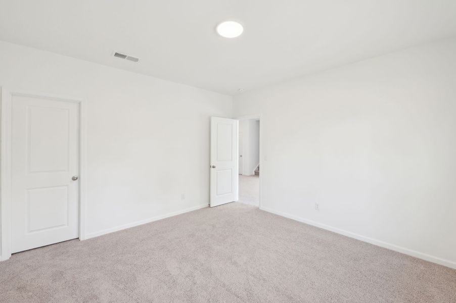 Representative unfurnished interior of a home built from the Alexis by Ashton Woods in Rowland's Grant, Fuquay Varina (Image 36).
